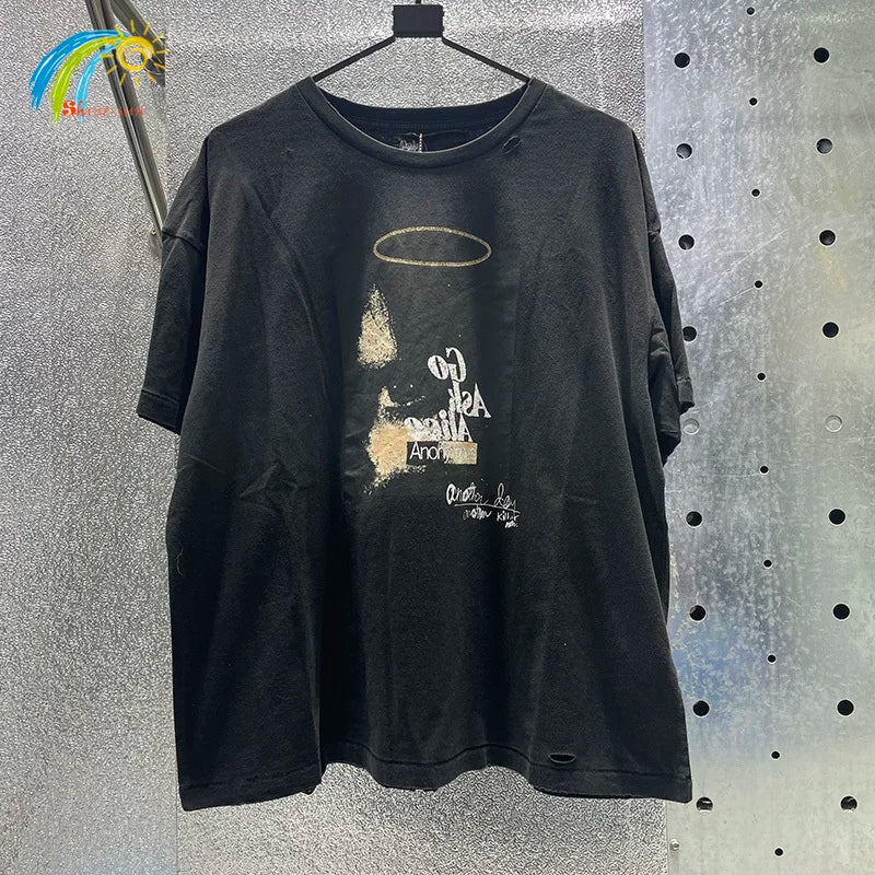 Black distressed cotton t-shirt featuring hip hop letters and faded gold halo with box graphics rhinestone detail