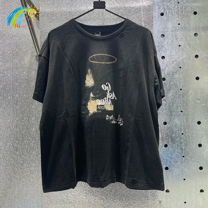 Black distressed cotton t-shirt featuring hip hop letters and faded gold halo with box graphics rhinestone detail