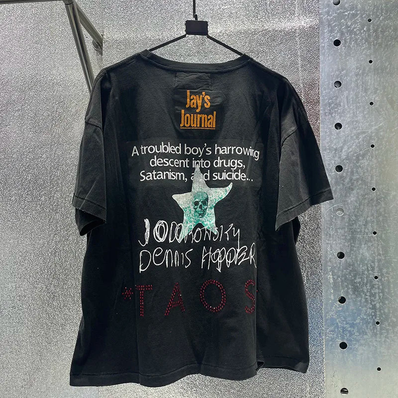 Black cotton t-shirt with hip hop letters, box graphics rhinestone, damaged hole paly design featuring teal skull and text