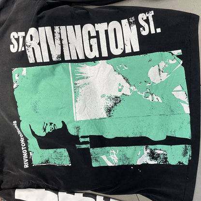 Black long sleeve oversized vintage t-shirt with distressed green and white hip hop letters logo print made of cotton