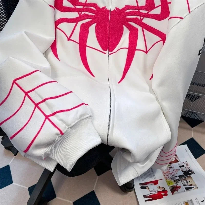 White zip-up hoodie featuring bold red spiderweb design and pink stitching in gothic y2k style for men and women