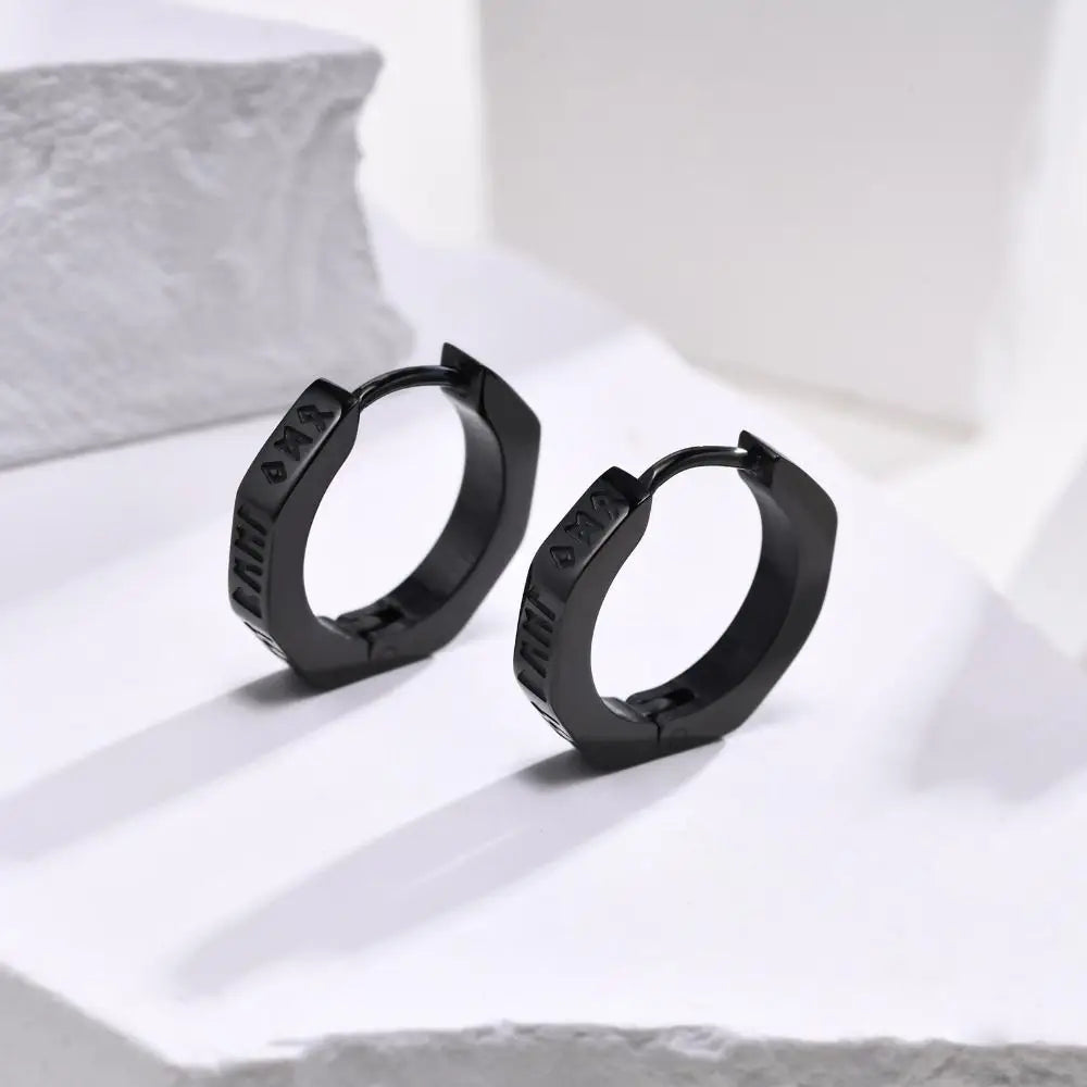 Black hexagonal hoop earrings with matte finish and engraved detailing made of stainless steel for street wear