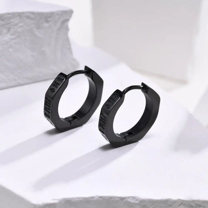 Black hexagonal hoop earrings with matte finish and engraved detailing made of stainless steel for street wear