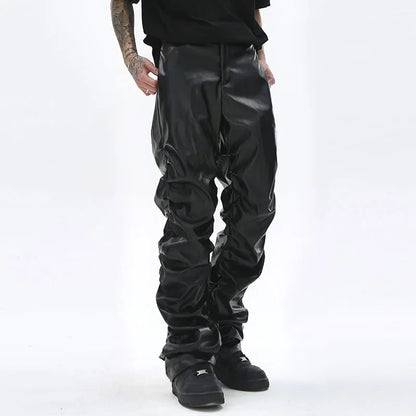 Black glossy faux leather hip hop mens pants with relaxed slouchy fit and visible stitching details
