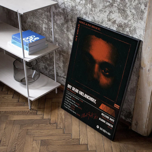 Black-framed weeknd starboy poster with orange portrait and white text tracklist living room canvas painting art