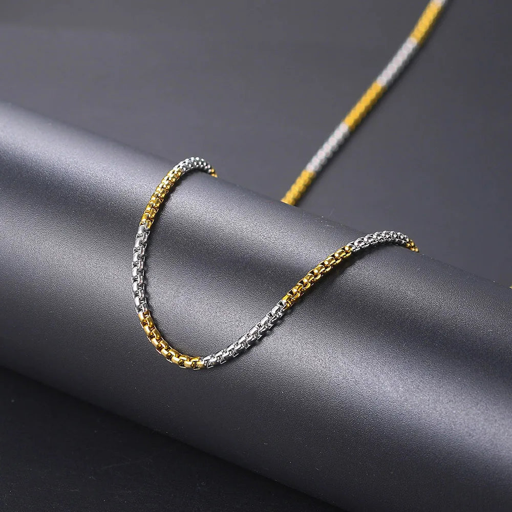 Two-tone gold and silver hip hop necklace featuring a steel necklace 3mm square pearl chain with interlocking design