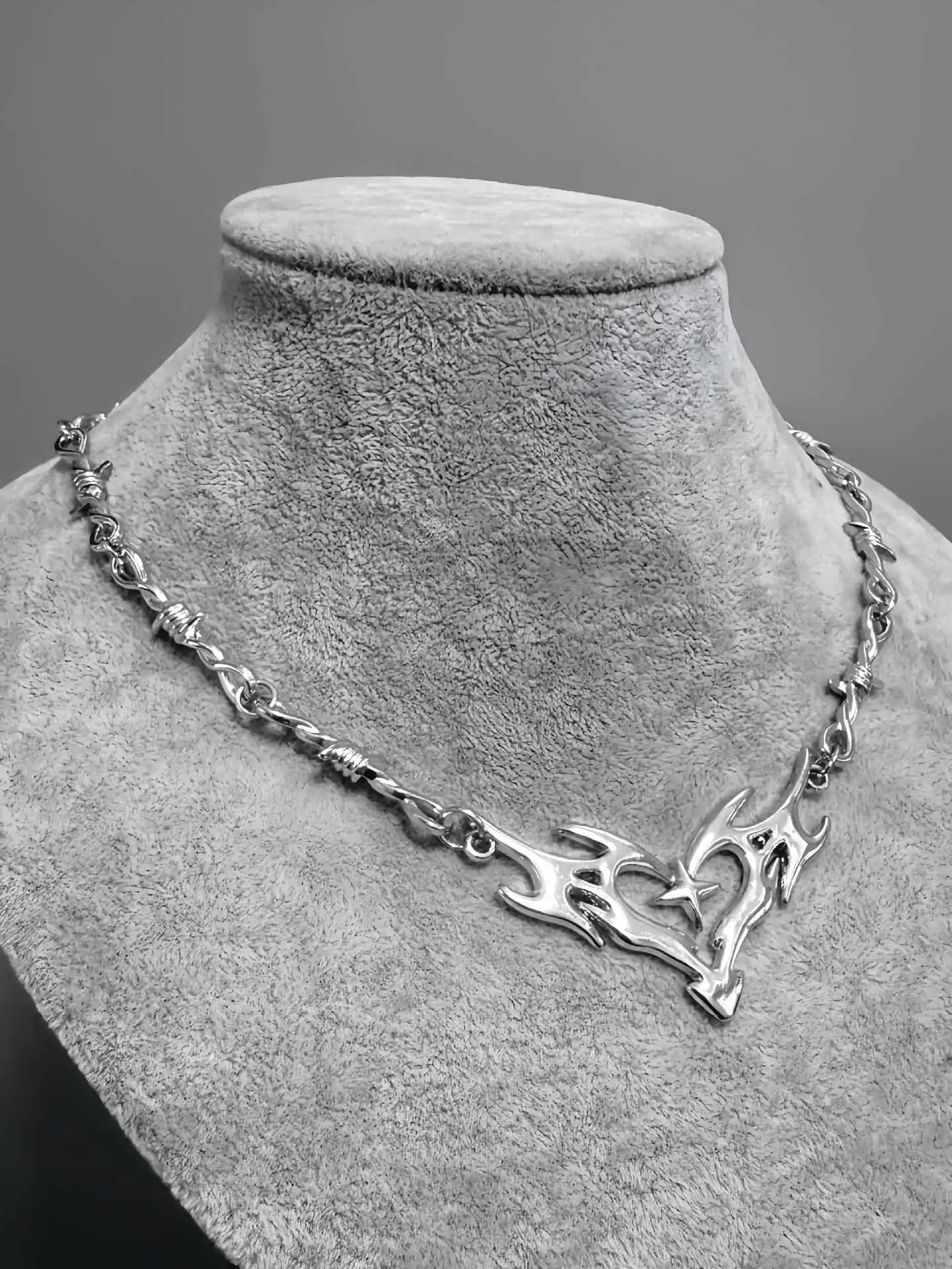 Silver barbed wire chain necklace with a flame totem heart pendant and cross thorny chain collar design for men and women