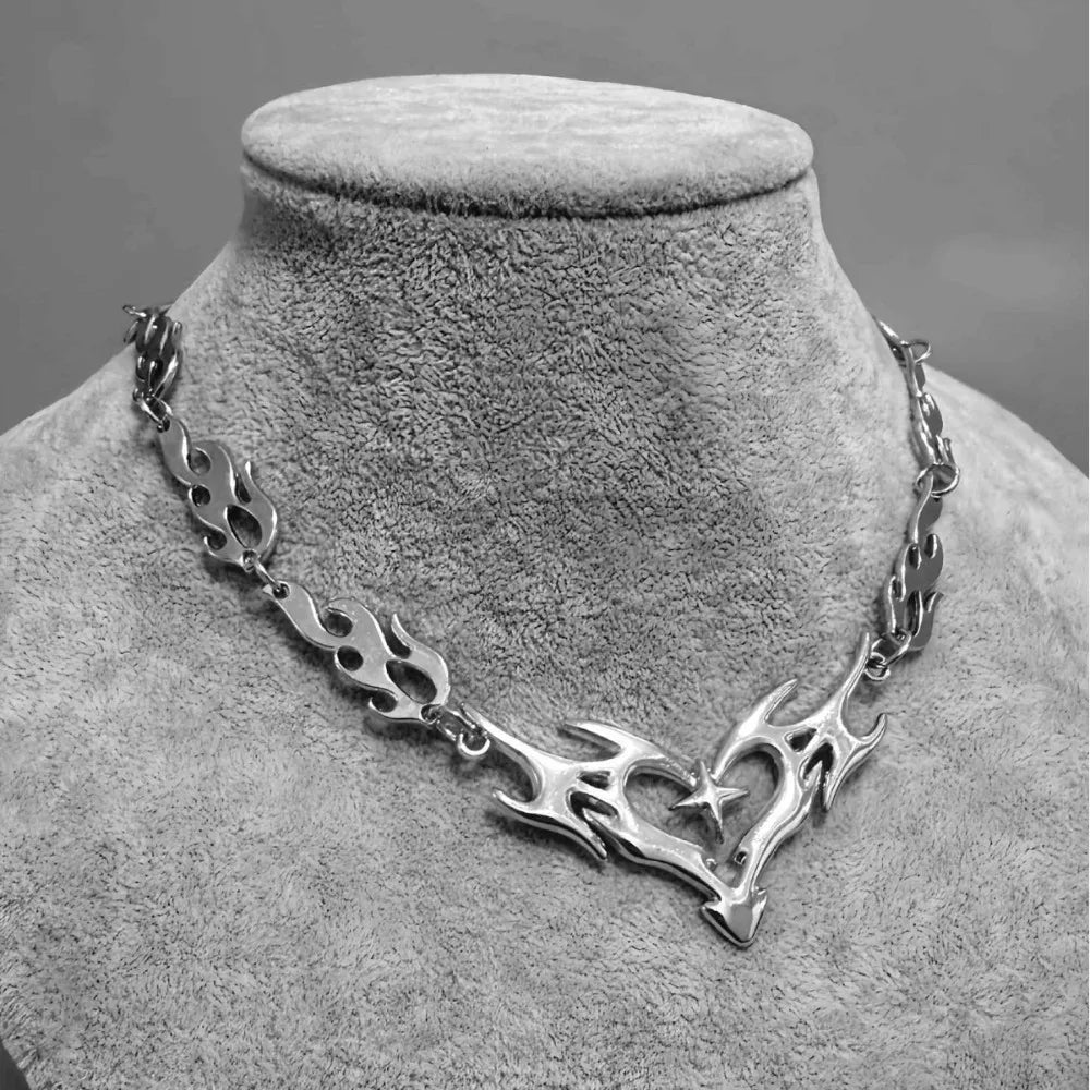Silver flame-patterned cross thorny chain necklace with hollowed-out heart pendant featuring a star design