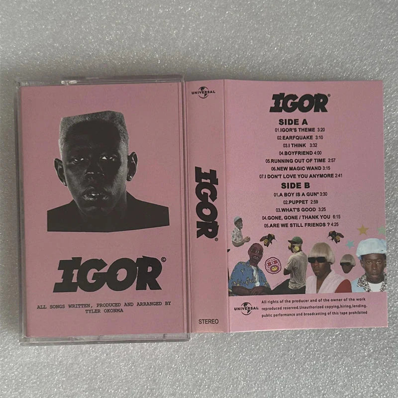 Pink cassette tape case for tyler the creators igor album with black and white portrait and illustrated track listings for hop rap igor cosplay recorder walkman