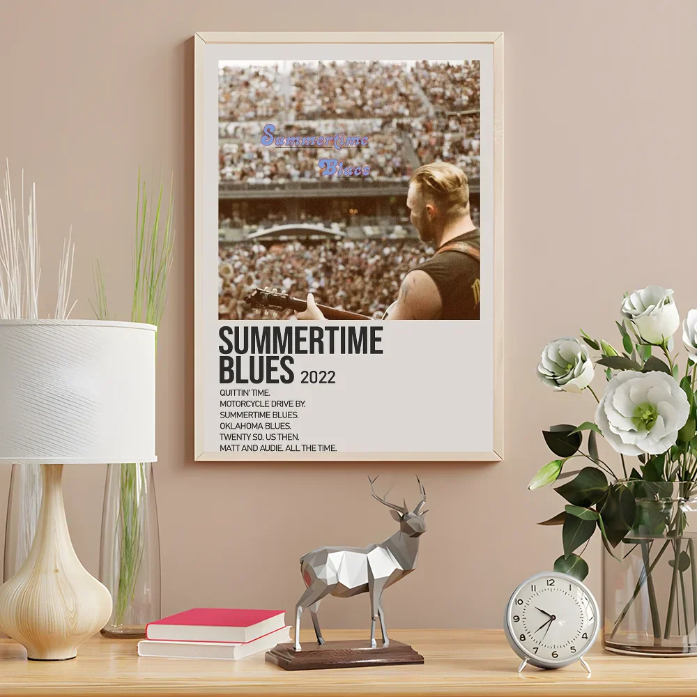 A geometric silver deer figurine with faceted design on dark wood base complements zach bryan poster wall art