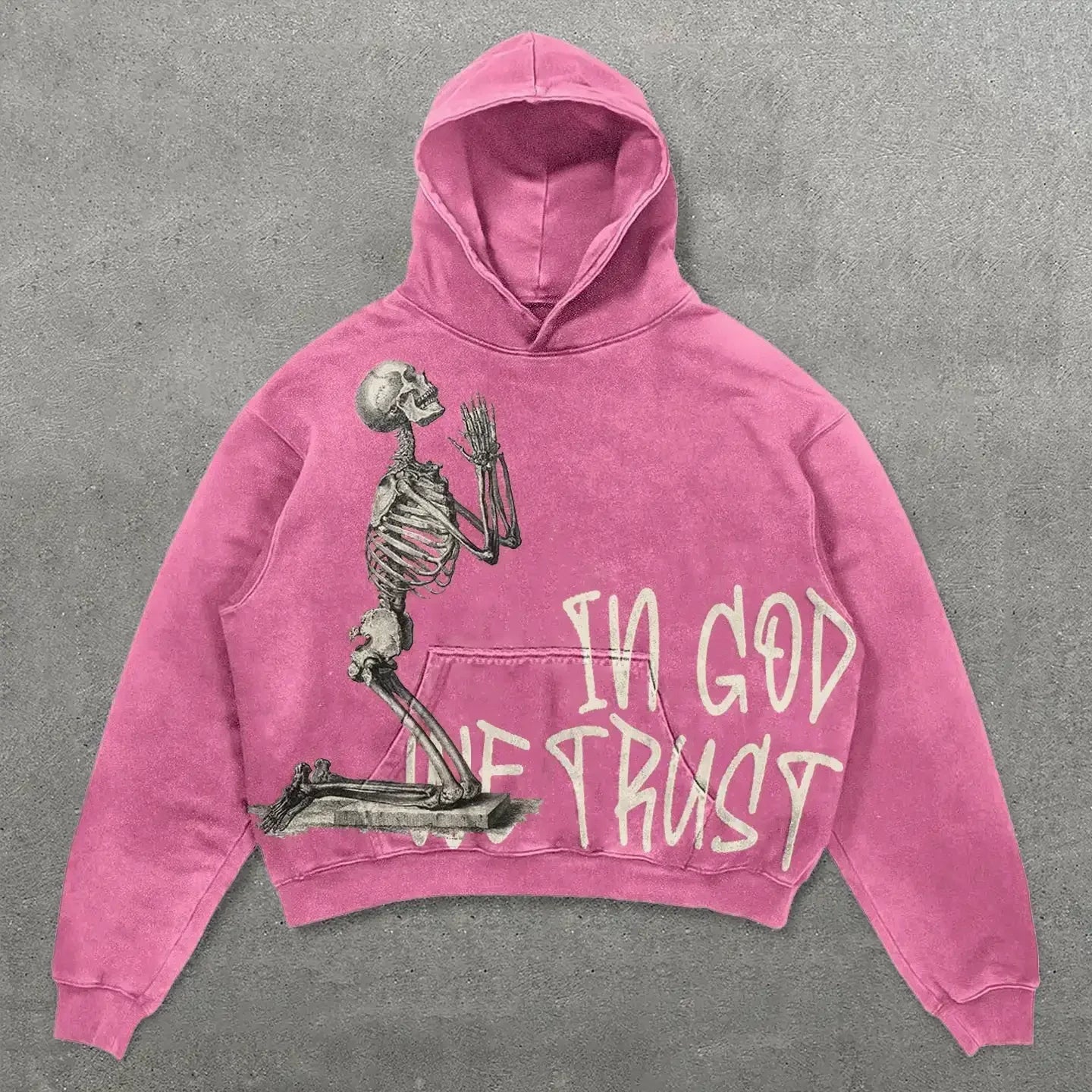 A vibrant pink oversized hoodie with a skeleton graphic and in god we trust lettering in harajuku hip hop style clothes men harajuku