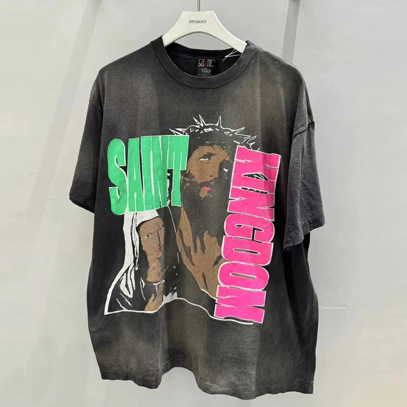 Black distressed high quality oversized hip hop retro t shirt with bold green and pink racing style graffiti saint kingdom design