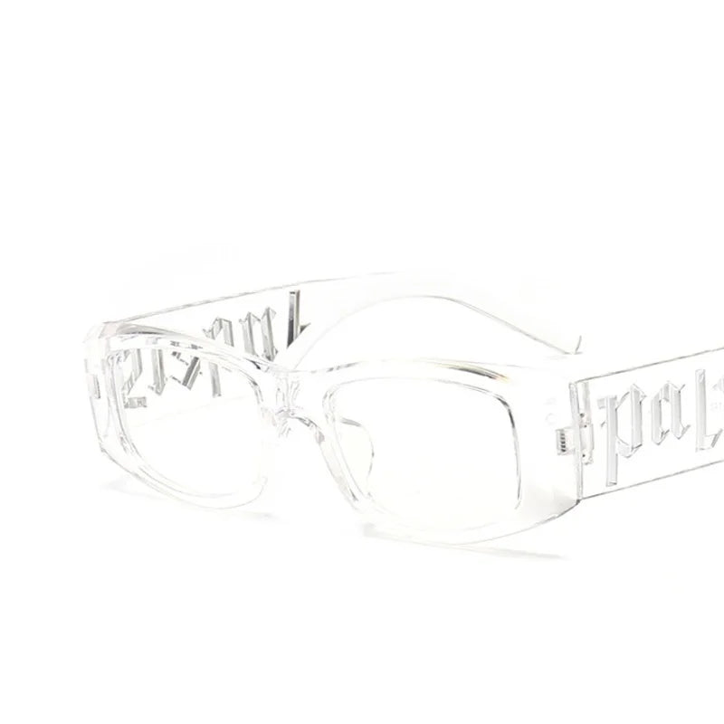 Clear acetate fashion sunglasses designer with bold geometric frame and embossed lettering on temples for unisex use