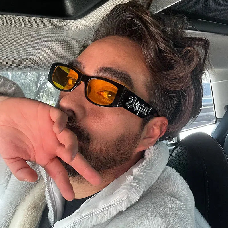 Black-framed fashion sunglasses designer with vibrant orange mirrored lenses and distinctive 23pou inscription on temple