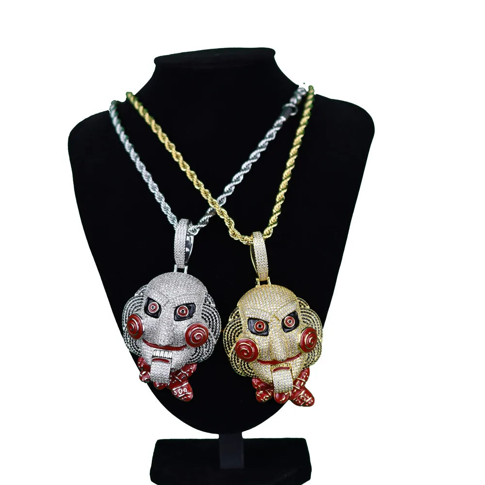 Two ice-encrusted silver and gold bling chain clown jigsaw face pendants with red eyes for hip hop statement billy chain necklace