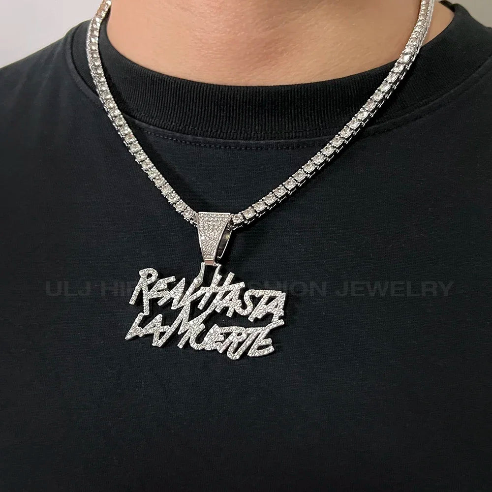 Silver diamond-encrusted realhasta lamuerte letter bling pendant on a matching bling chain iced for hip hop style