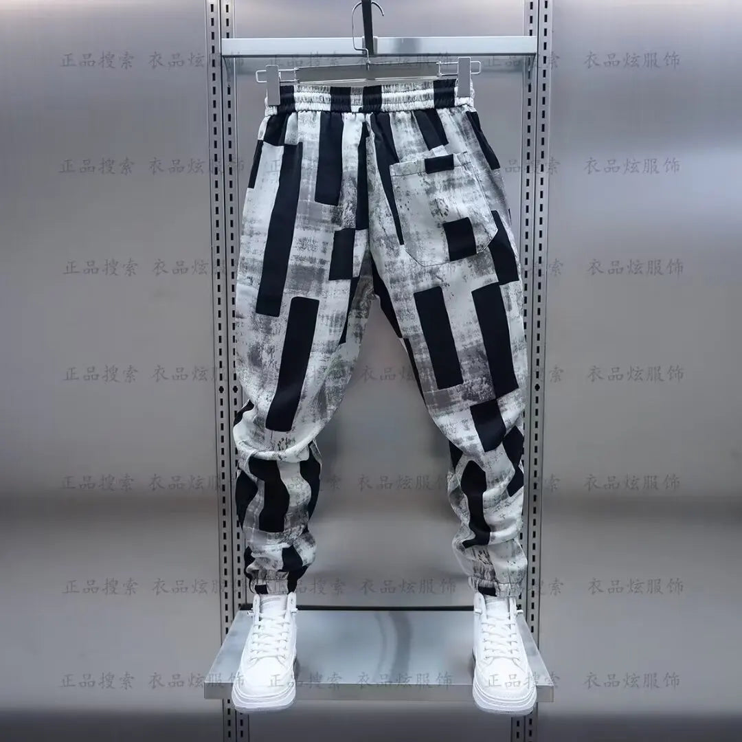Black and white geometric patterned jogging sweatpant luxury with elastic waistband and drawstring for men clothing streetwear