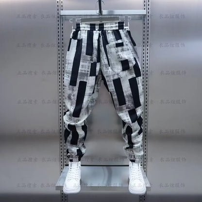 Black and white geometric patterned jogging sweatpant luxury with elastic waistband and drawstring for men clothing streetwear