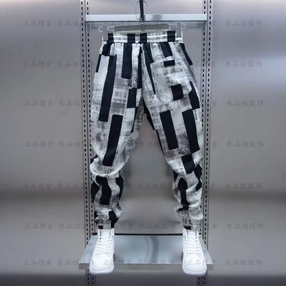 Black and white geometric-patterned wide-leg jogging sweatpant luxury with relaxed fit men clothing streetwear casual pants