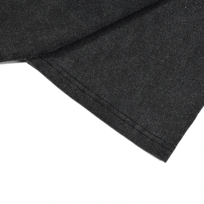 Dark heather gray cotton fabric with soft textured weave and stitched hem in hip hop streetwear oversized t shirt