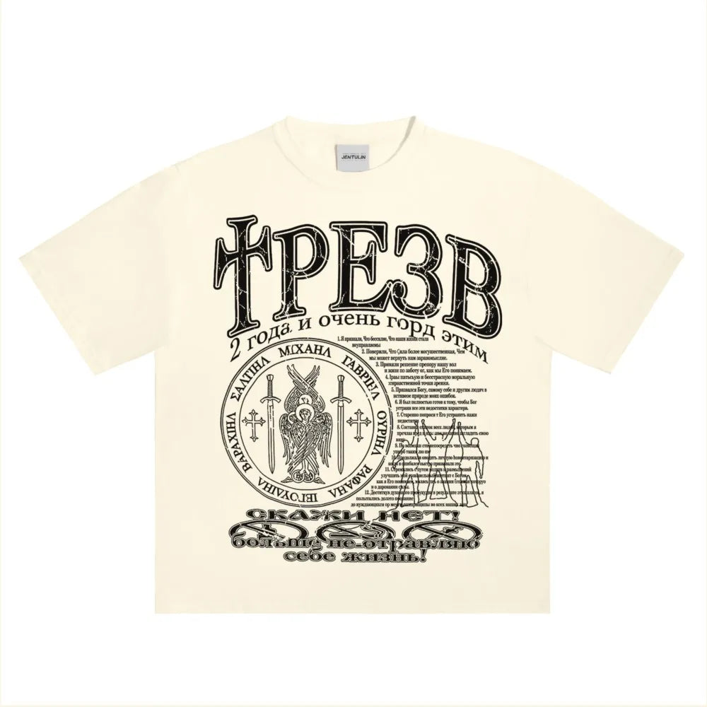 Cream-colored cotton hip hop streetwear t shirt with bold black graphic print y2k and ornate circular emblem