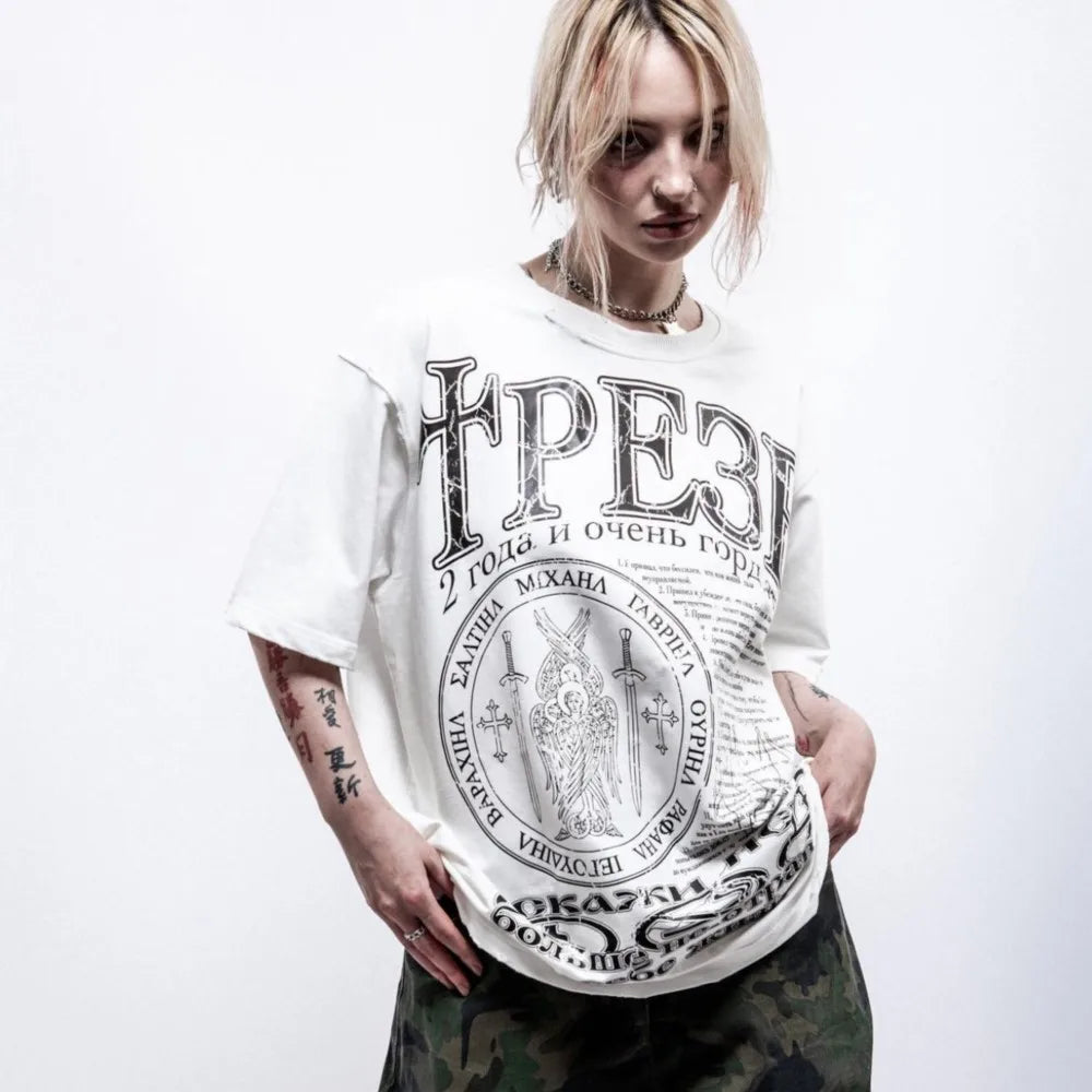 White oversized cotton t-shirt with black graphic print y2k featuring cyrillic text and hip hop streetwear style emblem