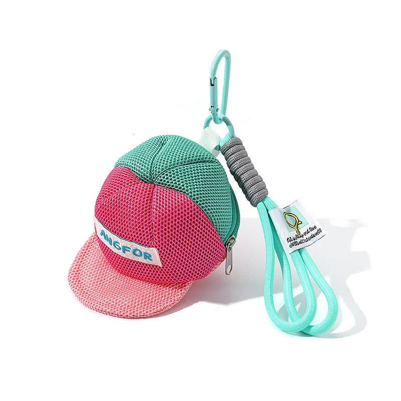 A vibrant pink and teal mesh baseball cap mini bag coin purse with angfor label mint green carabiner and braided cord