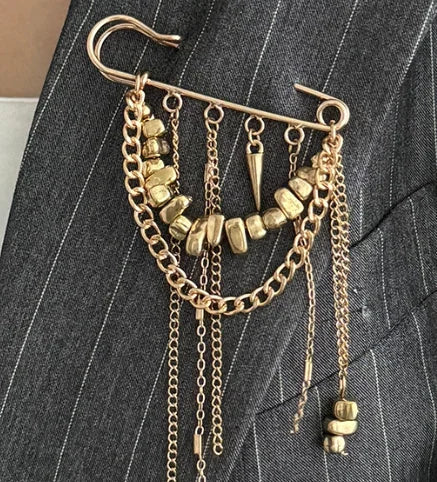 Gold-toned safety pin beaded fringed brooch with layered chains and spikes as a multi-functional pants anklet pin