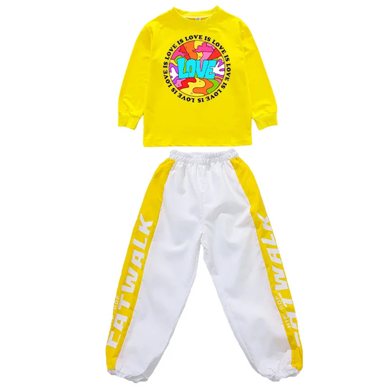 Bright yellow long-sleeved top with love is love graphic and white sweatpants with yellow side panels in hip hop clothing set