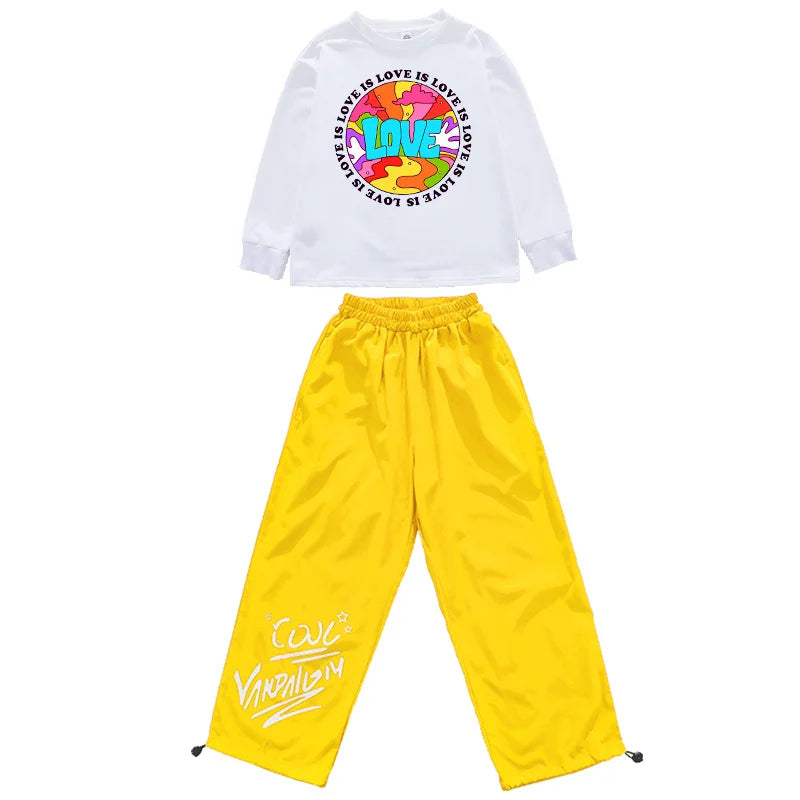 White long-sleeved tee with colorful love is love graphic and yellow satin pants with cursive branding hip hop clothing set