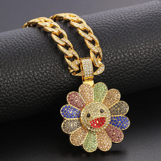 A vibrant multi-colored takahashi sunflower pendant with sparkling zirconia on an icy gold chain from a trendy brand personalized collection