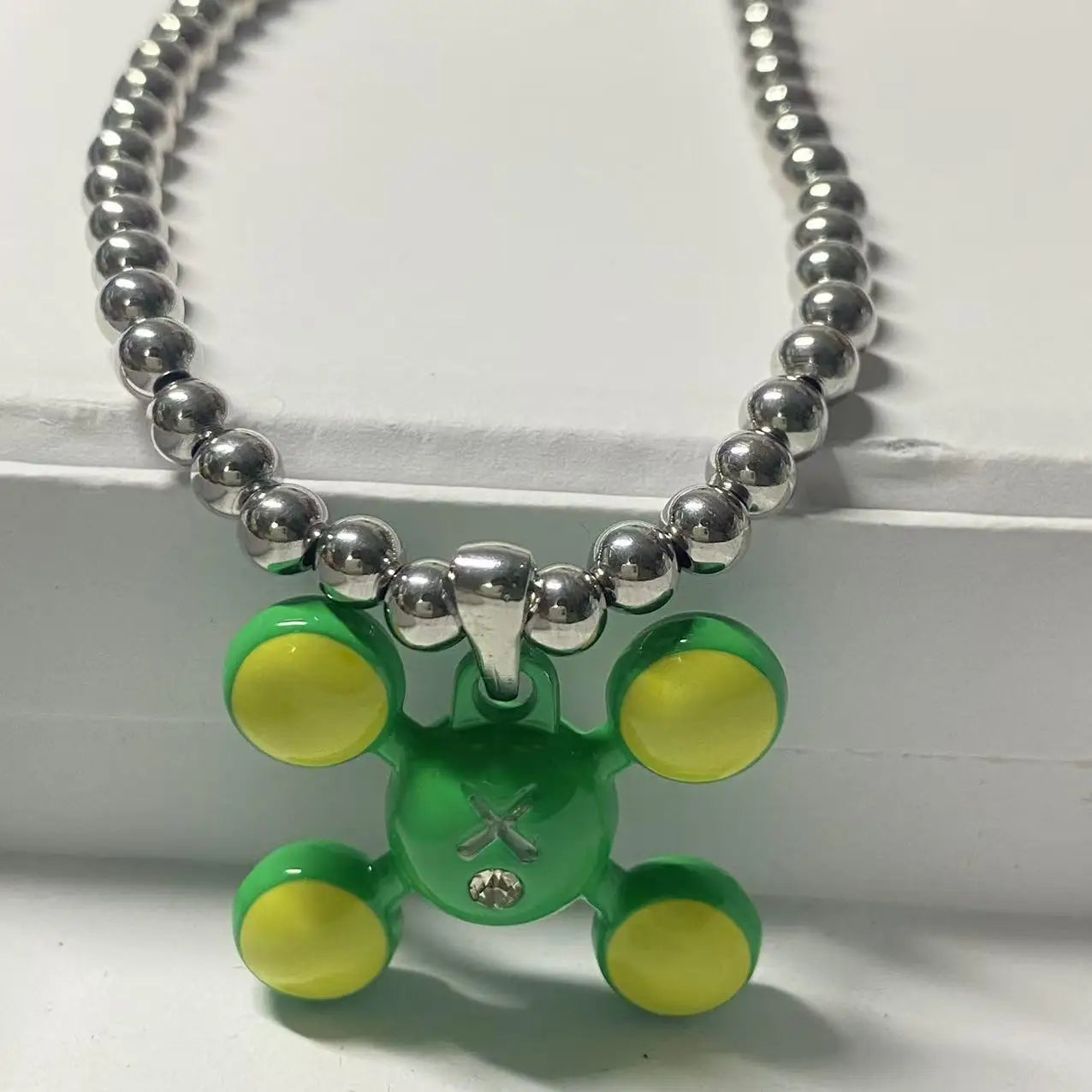 Green and yellow translucent bear pendant on a stainless steel bead chain rapper necklace niche design necklace gift