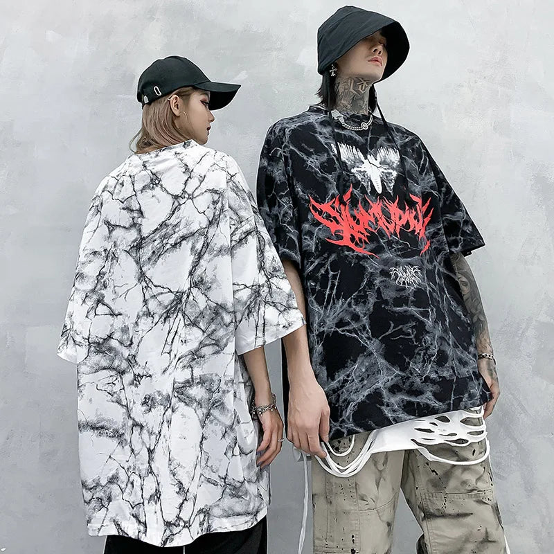 Black and white marble patterned oversized cotton t shirt with a bold red flame graphic for hip hop streetwear