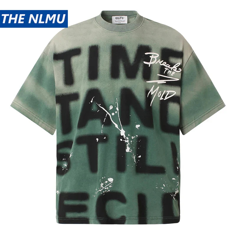 The nlmu oversized hip hop shirt harajuku cotton in faded sage features black letter graffiti tie text and white paint splatter