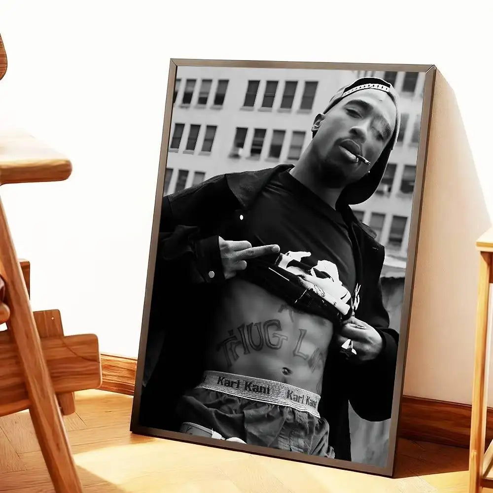 Black-and-white framed canvas print of tupac shakur in thug life pose with karl kani belt and gun for home decor gift