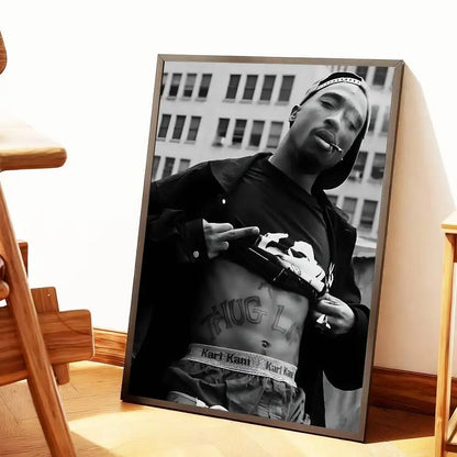 Black-and-white framed canvas print of tupac shakur in thug life pose with karl kani belt and gun for home decor gift