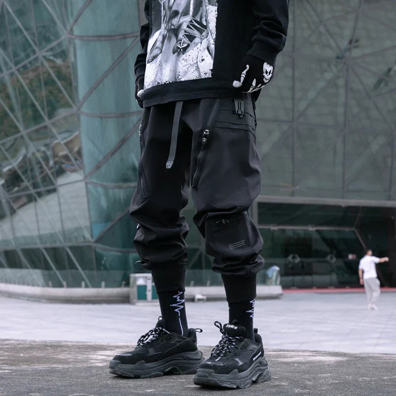 Black hip hop tactical cargo pants for men featuring multiple pockets zipper joggers with elastic waist streetwear design