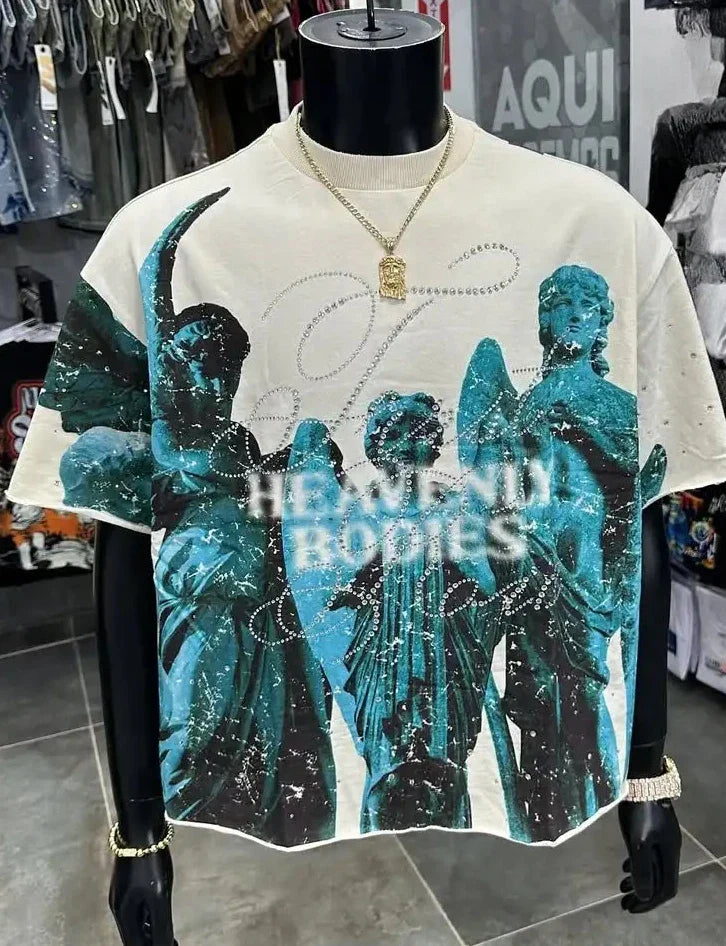 Cream-colored short-sleeved high quality y2k t-shirt with teal angelic print and heavenly bodies text hip hop trend cool design sense