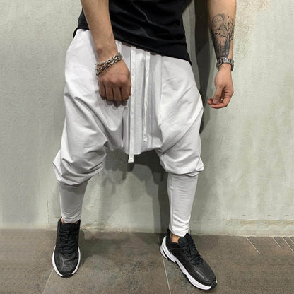 White loose-fitting jogger pants with drawstring waist and tapered legs in hip hop trend loose solid style