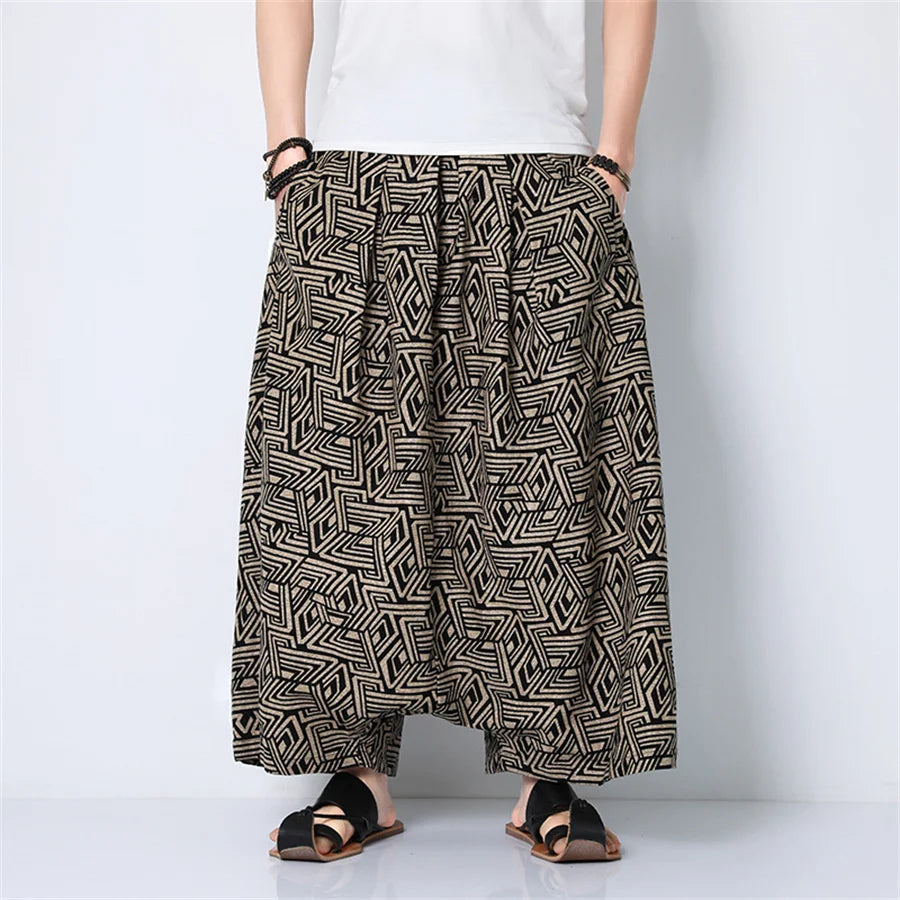 Black and beige geometric patterned loose fitting men harem pants with a relaxed silhouette for hip hop trend streetwear