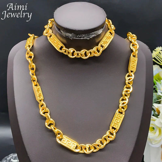 Gold-colored hip hop trendy chunky necklace bracelet with engraved greek key patterns in african jewelry set display