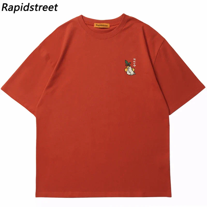 Rust-colored hip hop tshirt with short sleeves and a small embroidered cartoon on the left chest streetwear harajuku style with japanese kanji drink graphic