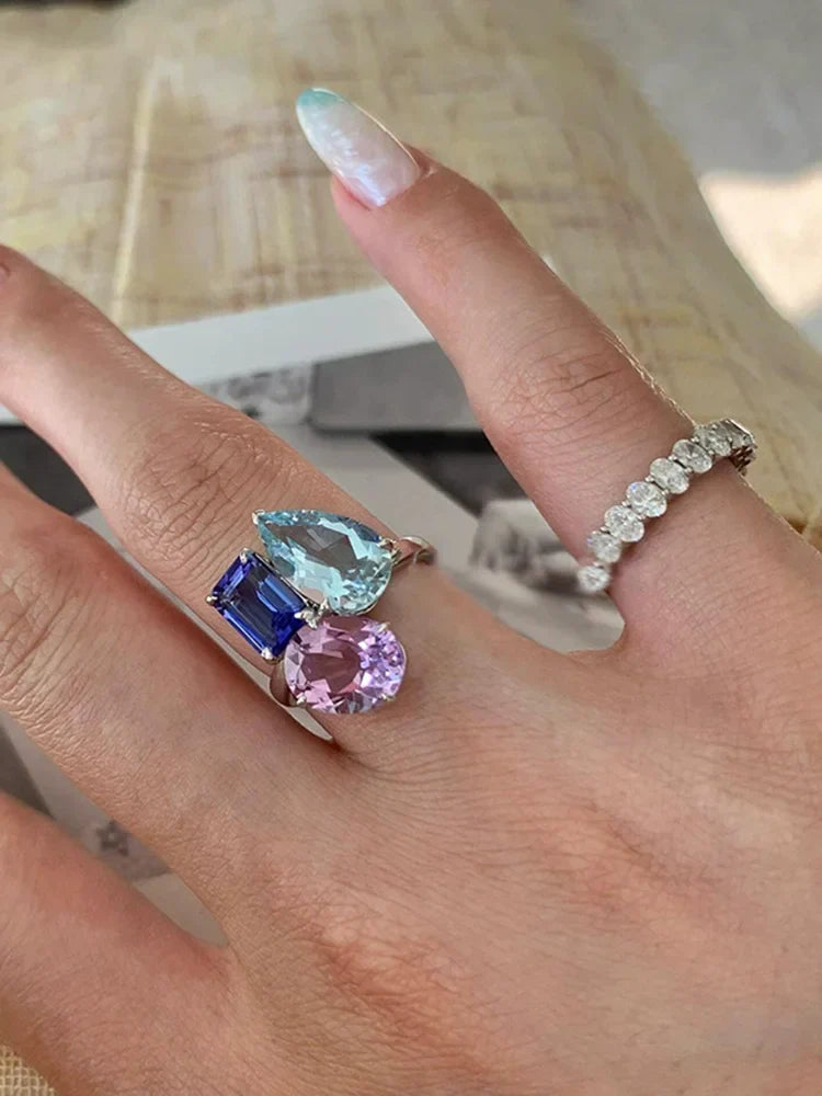 A hip hop unique multi-stone silver ring with teal, blue, and purple zircon stones for women punk fashion accessories