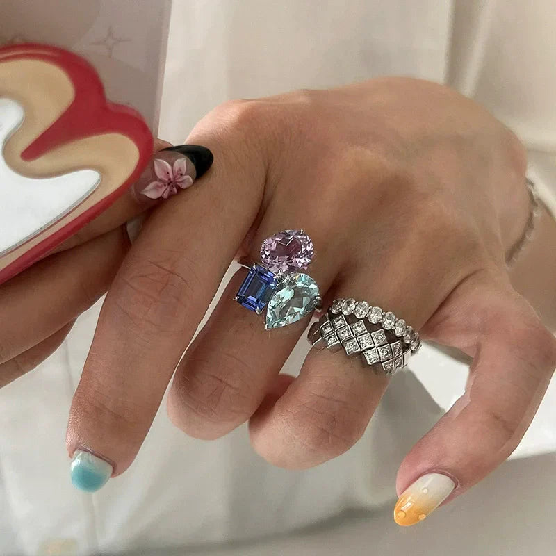 A silver band hip hop unique bling zircon ring with a geometric diamond pattern for women punk fashion accessories