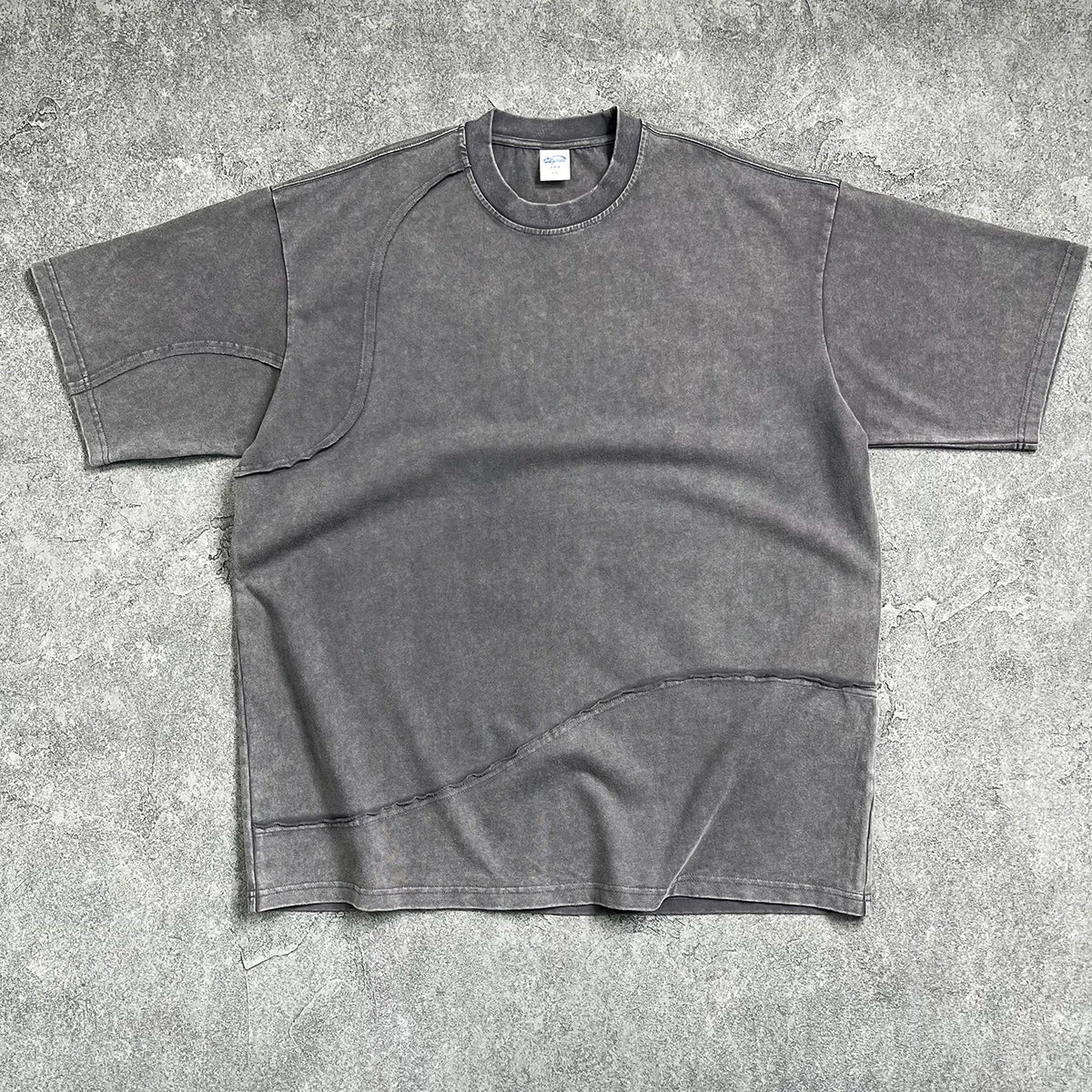 Dark gray oversized cotton hip hop wax sleeve tee with relaxed fit curved seams and quality raw edges