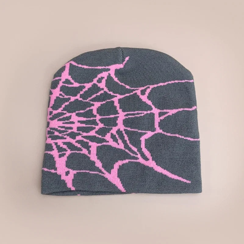 A dark gray wool hip hop beanie with a vibrant pink spiderweb pattern for autumn and winter street fashion