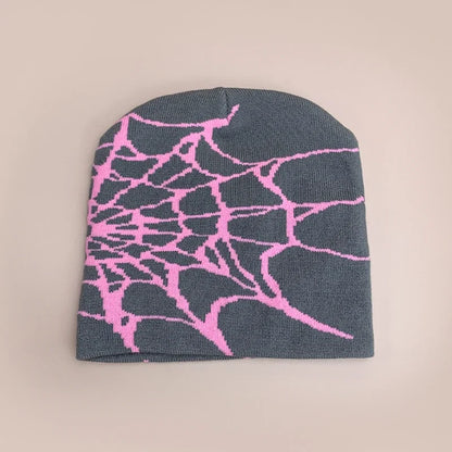 A dark gray wool hip hop beanie with a vibrant pink spiderweb pattern for autumn and winter street fashion