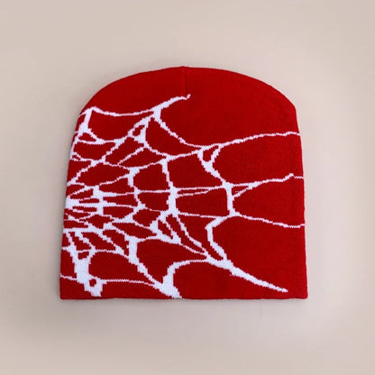 Red knit wool beanie with white spiderweb pattern for warm gothic hip hop style street fashion in autumn and winter