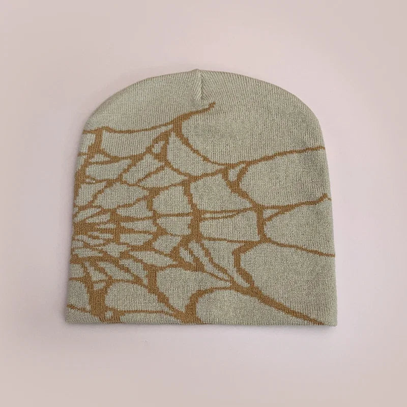 A light green wool hip hop knit beanie with a tan web pattern for autumn and winter fashion