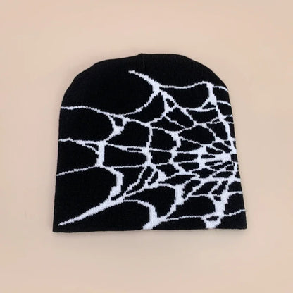 Black wool knit beanie with bold white spiderweb pattern designed for hip hop street style autumn and winter wear